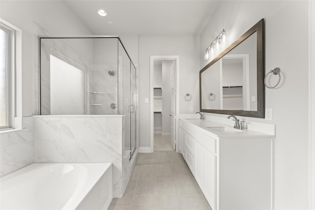 bathroom with vanity and separate shower and tub