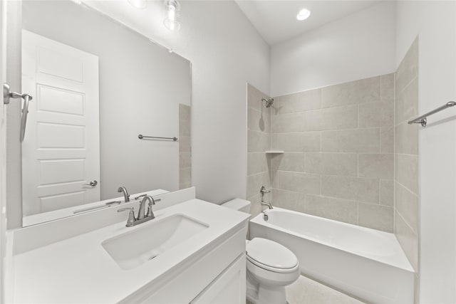 full bathroom with vanity, toilet, and tiled shower / bath combo