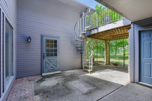 view of patio featuring a balcony