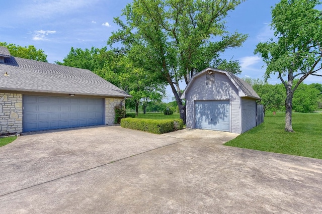 garage with a yard