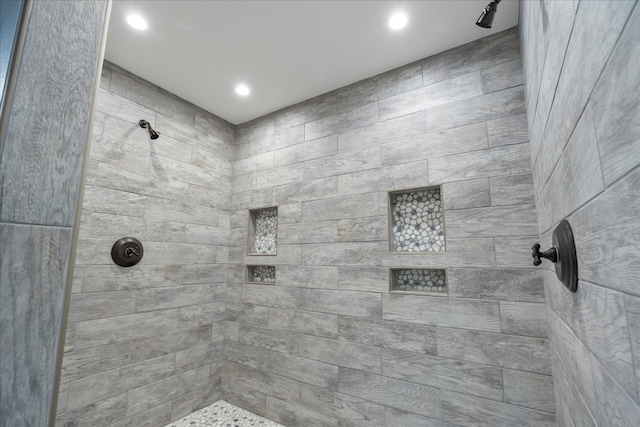 bathroom with tiled shower