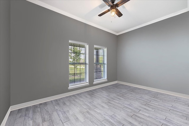 spare room featuring ceiling fan, light wood-type flooring, and ornamental molding