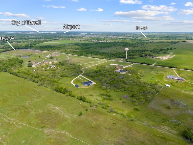 birds eye view of property with a rural view