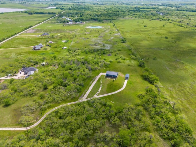 birds eye view of property featuring a rural view