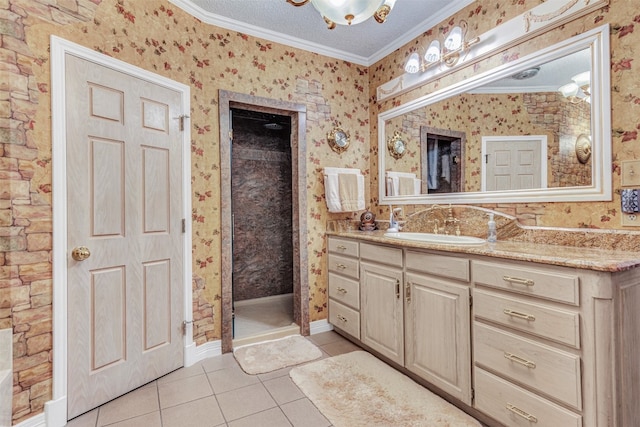 bathroom featuring crown molding, vanity with extensive cabinet space, and tile flooring