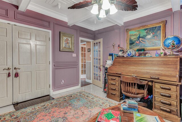 home office with coffered ceiling, crown molding, beam ceiling, and ceiling fan