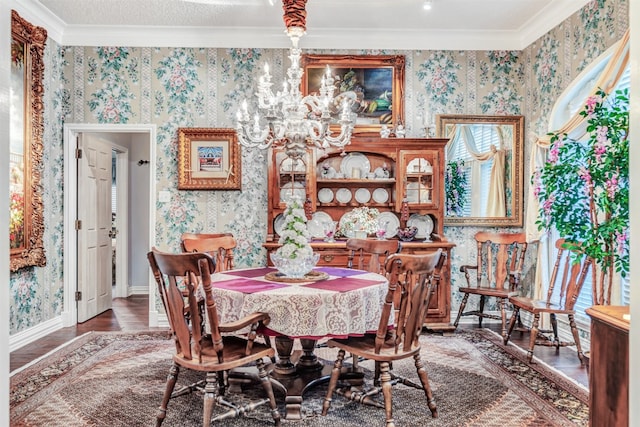 dining area featuring ornamental molding and dark hardwood / wood-style flooring