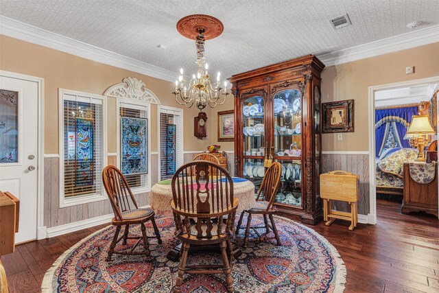 living room with ornamental molding, ceiling fan with notable chandelier, dark hardwood / wood-style floors, and a textured ceiling