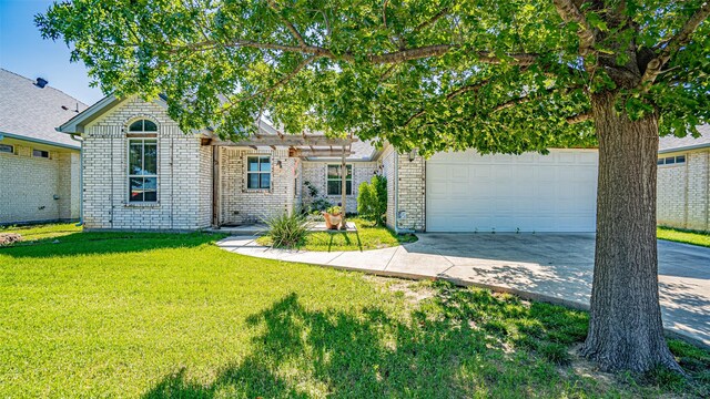 view of front of home with a garage and a front yard