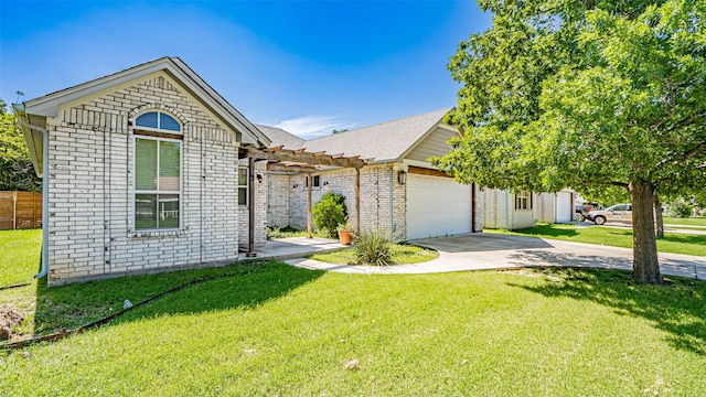 view of front of home featuring a garage and a front lawn