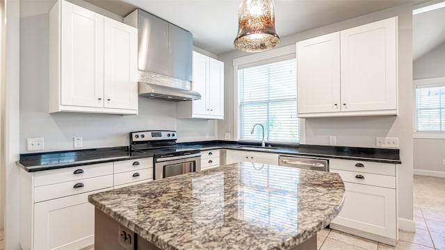 kitchen with stainless steel appliances and white cabinetry