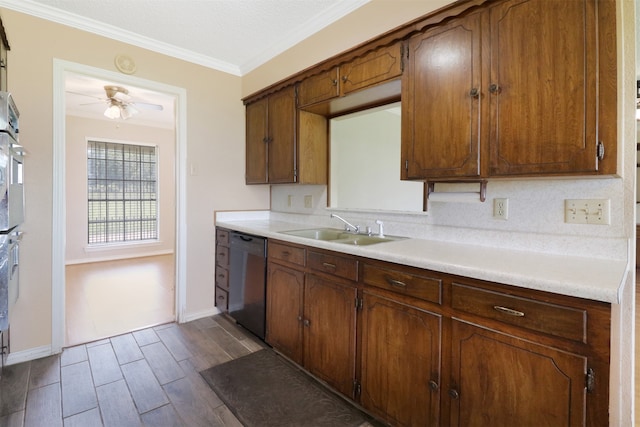 kitchen with sink, crown molding, ceiling fan, and appliances with stainless steel finishes