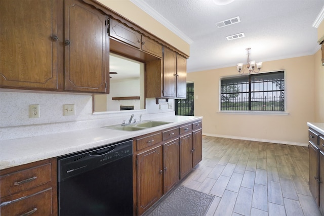 kitchen featuring sink, dishwasher, backsplash, hanging light fixtures, and ornamental molding