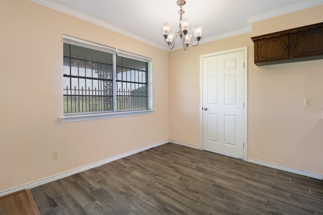 unfurnished dining area featuring a notable chandelier, dark wood-type flooring, ornamental molding, and a textured ceiling