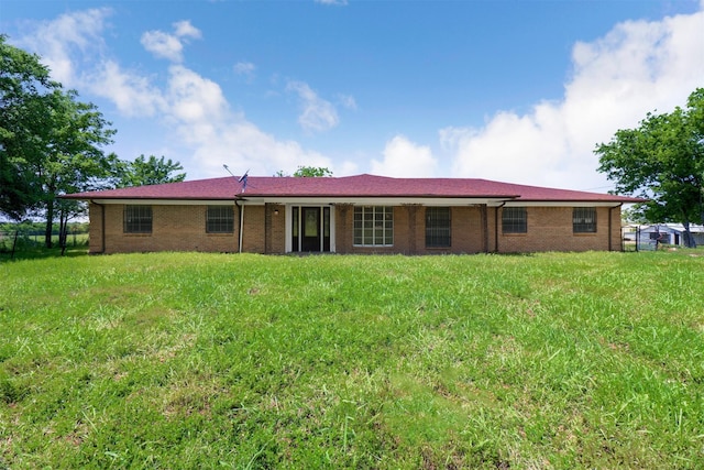 back of house with a yard