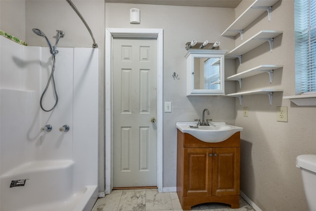 bathroom with toilet, a shower, and vanity