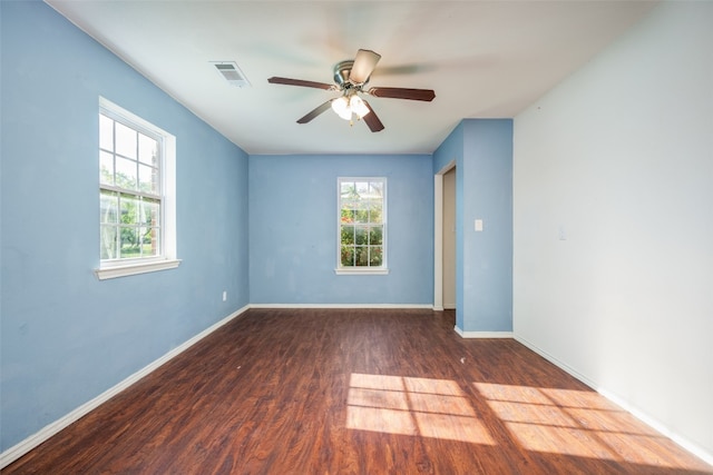 spare room with ceiling fan and wood-type flooring