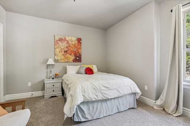 bedroom with light colored carpet