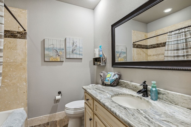 full bathroom with hardwood / wood-style floors, toilet, shower / bath combo, and oversized vanity