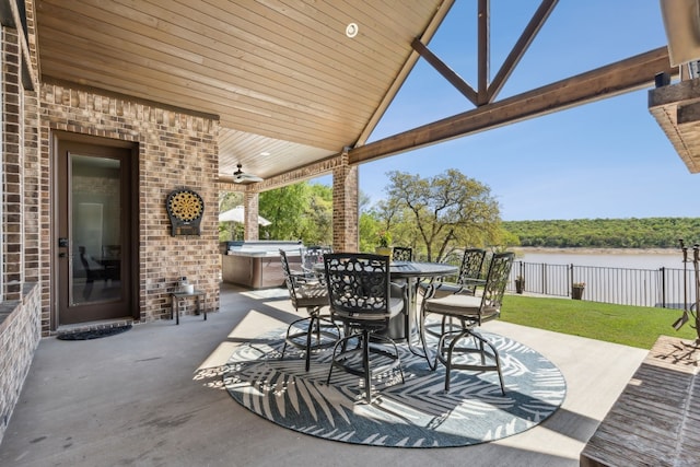 view of terrace featuring a hot tub