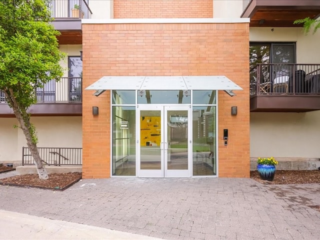 rear view of property featuring a balcony