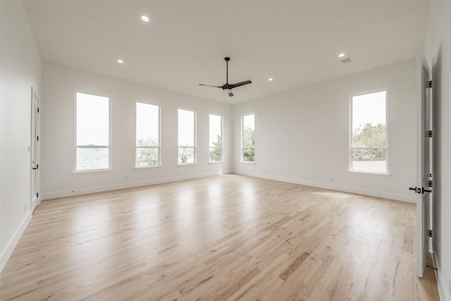 empty room featuring light hardwood / wood-style floors and ceiling fan