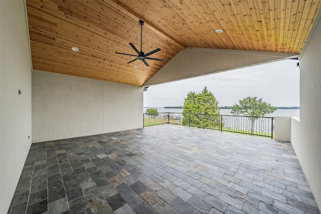 view of patio / terrace with ceiling fan and a water view