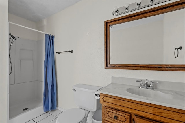 bathroom featuring vanity, a shower with curtain, toilet, and tile patterned flooring