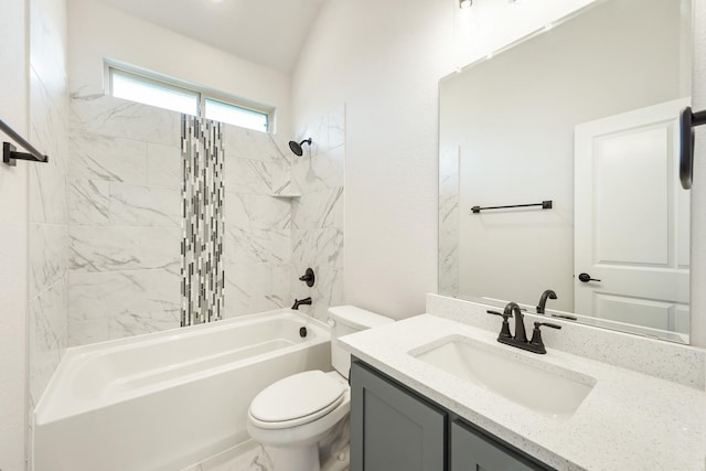 full bathroom with vanity, toilet, tiled shower / bath, and lofted ceiling