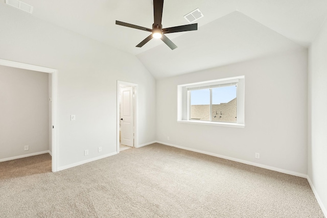 unfurnished bedroom featuring carpet flooring, ceiling fan, and vaulted ceiling