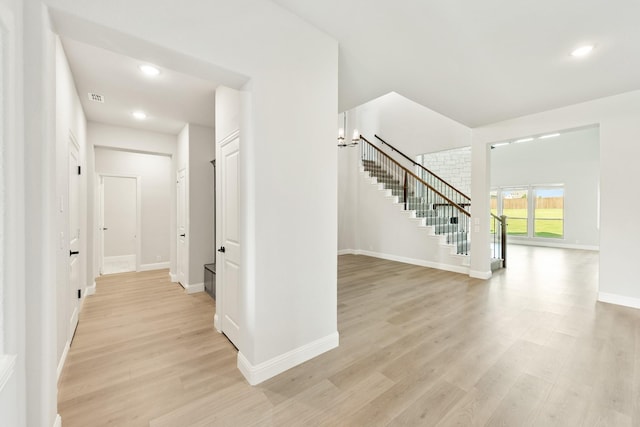 hallway with light wood-type flooring