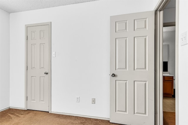 unfurnished bedroom with light carpet