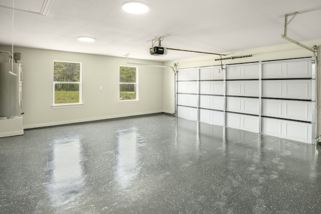 garage with a garage door opener and electric water heater