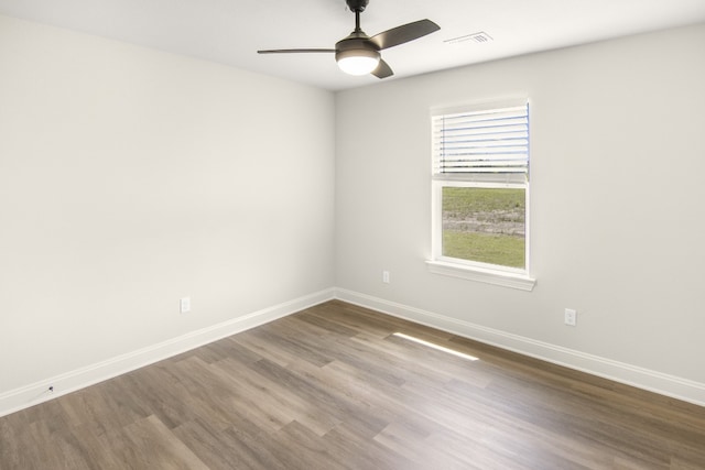 empty room featuring hardwood / wood-style flooring and ceiling fan