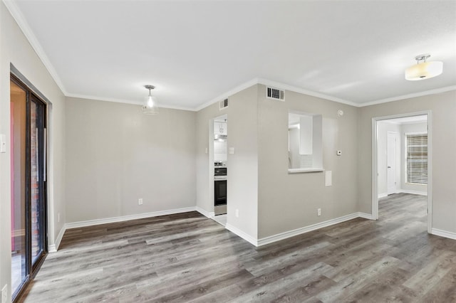 interior space featuring ornamental molding and wood-type flooring