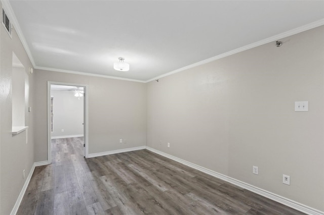 spare room featuring crown molding, ceiling fan, and dark hardwood / wood-style floors