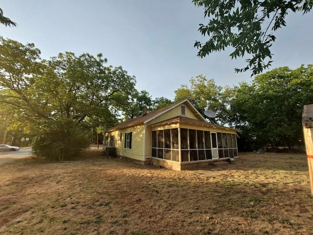 exterior space featuring a sunroom