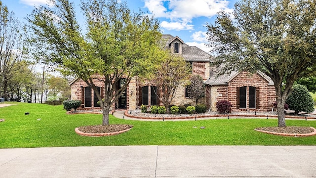 tudor home with a front yard