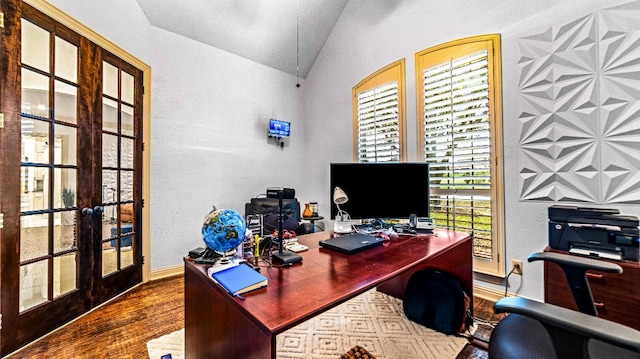 office space featuring french doors, dark hardwood / wood-style floors, and lofted ceiling