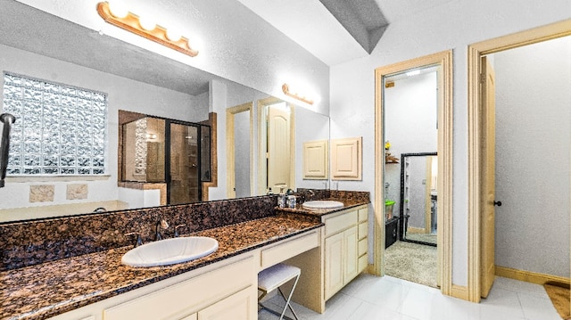 bathroom with double sink, tile floors, and large vanity