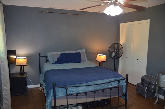 bedroom with ceiling fan and dark wood-type flooring