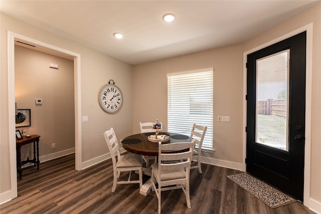 dining area featuring dark hardwood / wood-style floors