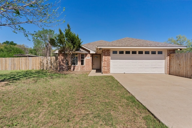 single story home featuring a front lawn and a garage