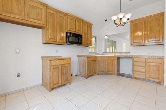 kitchen featuring an inviting chandelier, lofted ceiling, light tile floors, decorative light fixtures, and sink