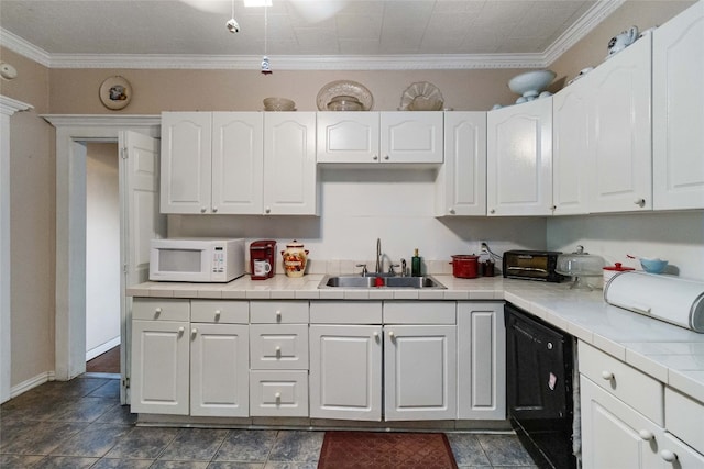 kitchen featuring crown molding, dishwasher, dark tile flooring, sink, and white cabinetry