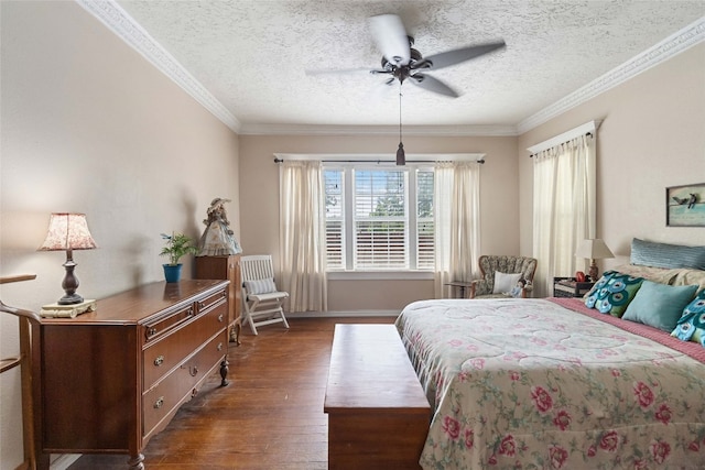 bedroom featuring dark hardwood / wood-style flooring, ornamental molding, ceiling fan, and a textured ceiling