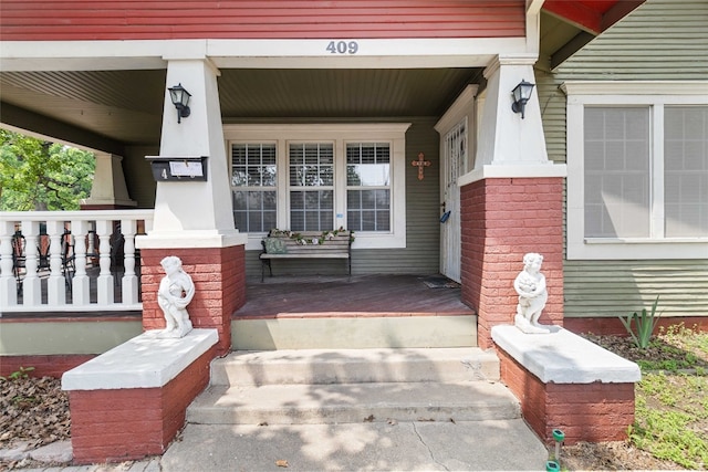 property entrance with covered porch