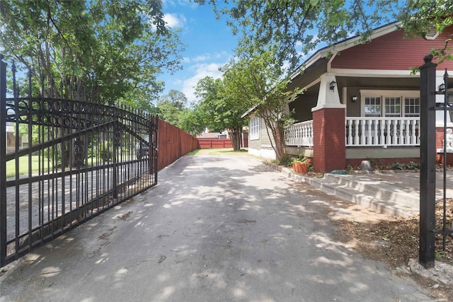 view of side of property with a porch