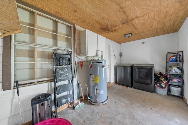 utility room featuring water heater and washing machine and dryer