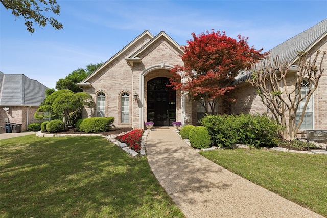 view of front of home with a front lawn